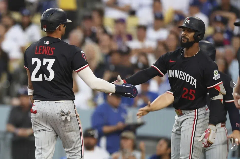 Royce Lewis and Byron Buxton high five after a Christian Vazquez RBI Double (AP Photo/Eric Thayer)
