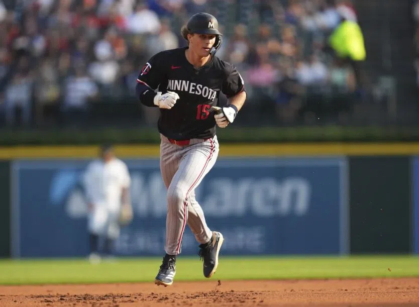 Minnesota Twins' Luke Keaschall rounds second base on his two run home run in the top of the first inning, the first in his career (AP Photo/Paul Sancya)