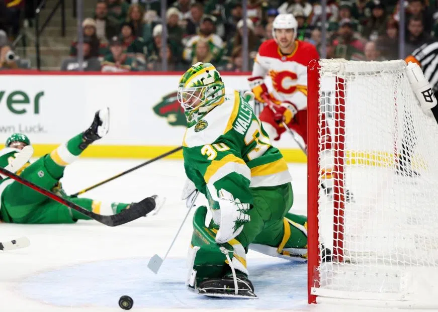 Minnesota Wild Goaltender Jesper Wallstedt saves the puck on a shot on goal