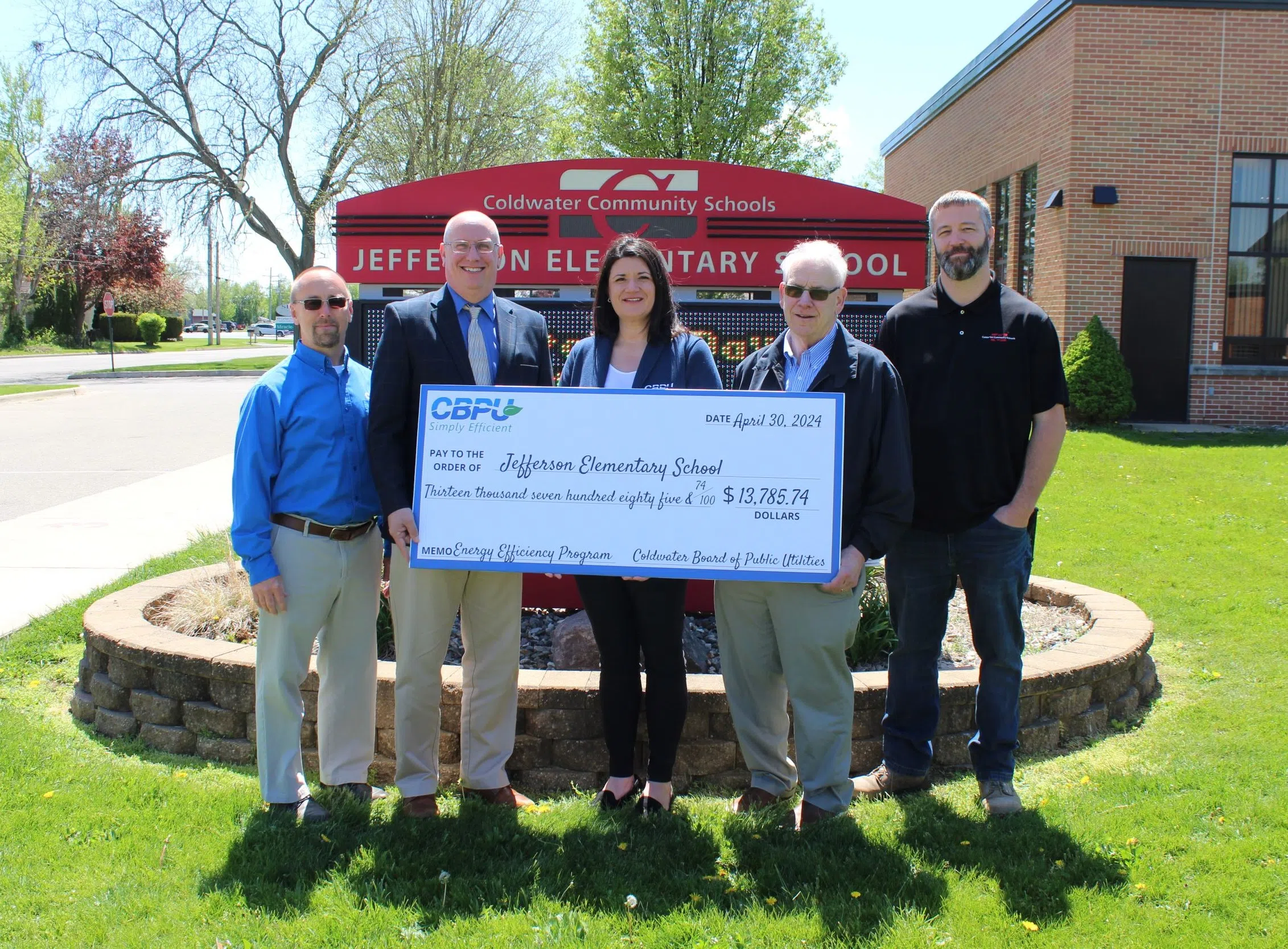 CBPU presents nearly $14,000 energy saving rebate check to 