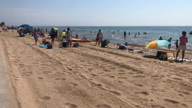 People flee the heat to the beaches of Lake Michigan | WTAQ News Talk | 97.5 FM · 1360 AM