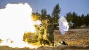 soldiers fire an anti armour weapon 