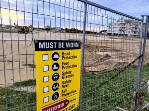 The work site shows some earth being moved around and graded 