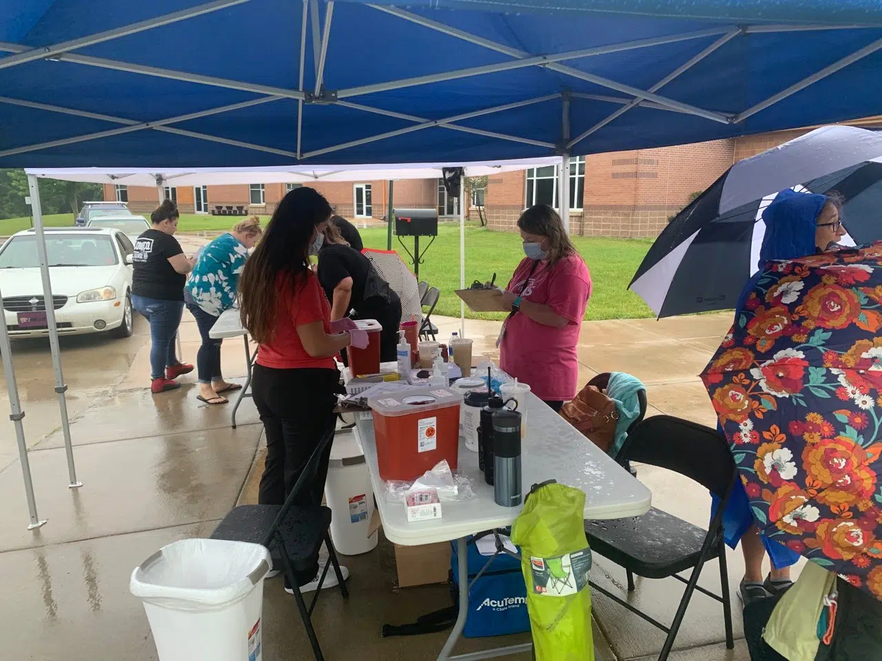 CORONAVIRUS: Area residents dodge raindrops to get vaccinations through first #VaxToNormal clinic