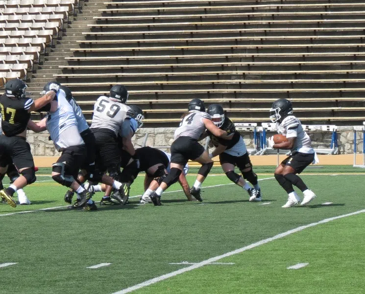 Emporia State football team enjoys ice cream bars. Running backs young but talented