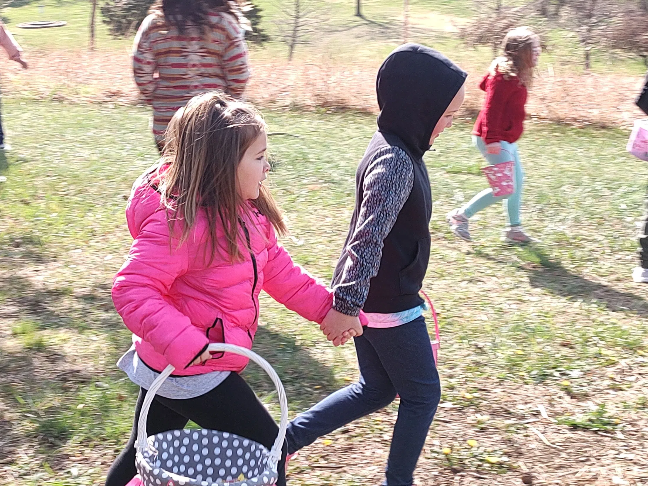 Gone in minutes; Hundreds of children descend on Jones Park for annual Flint Hills Optimist Club Easter egg hunt Saturday