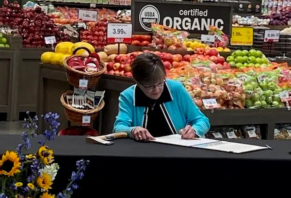 Kansas governor signs bill gradually eliminating state's sales tax on groceries