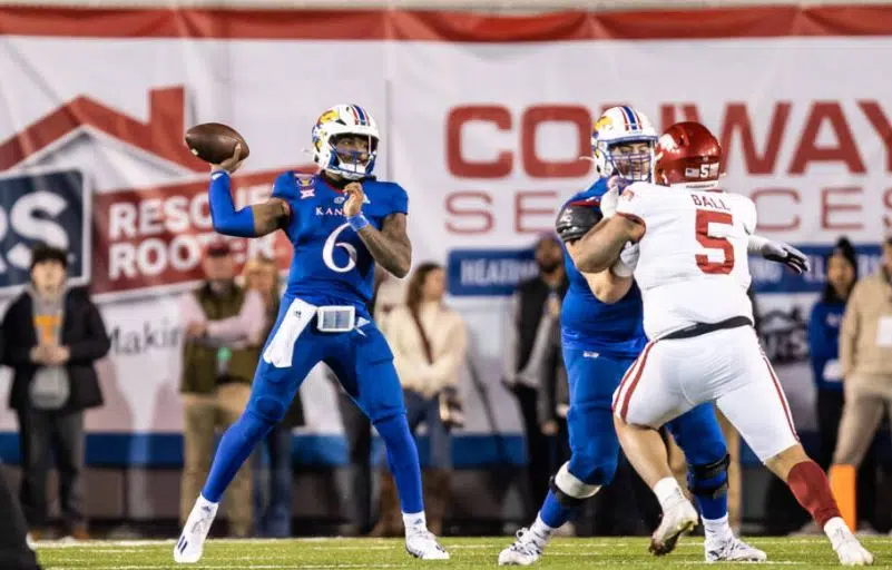 Arkansas outscores Kansas 55-53 in triple overtime in Liberty Bowl