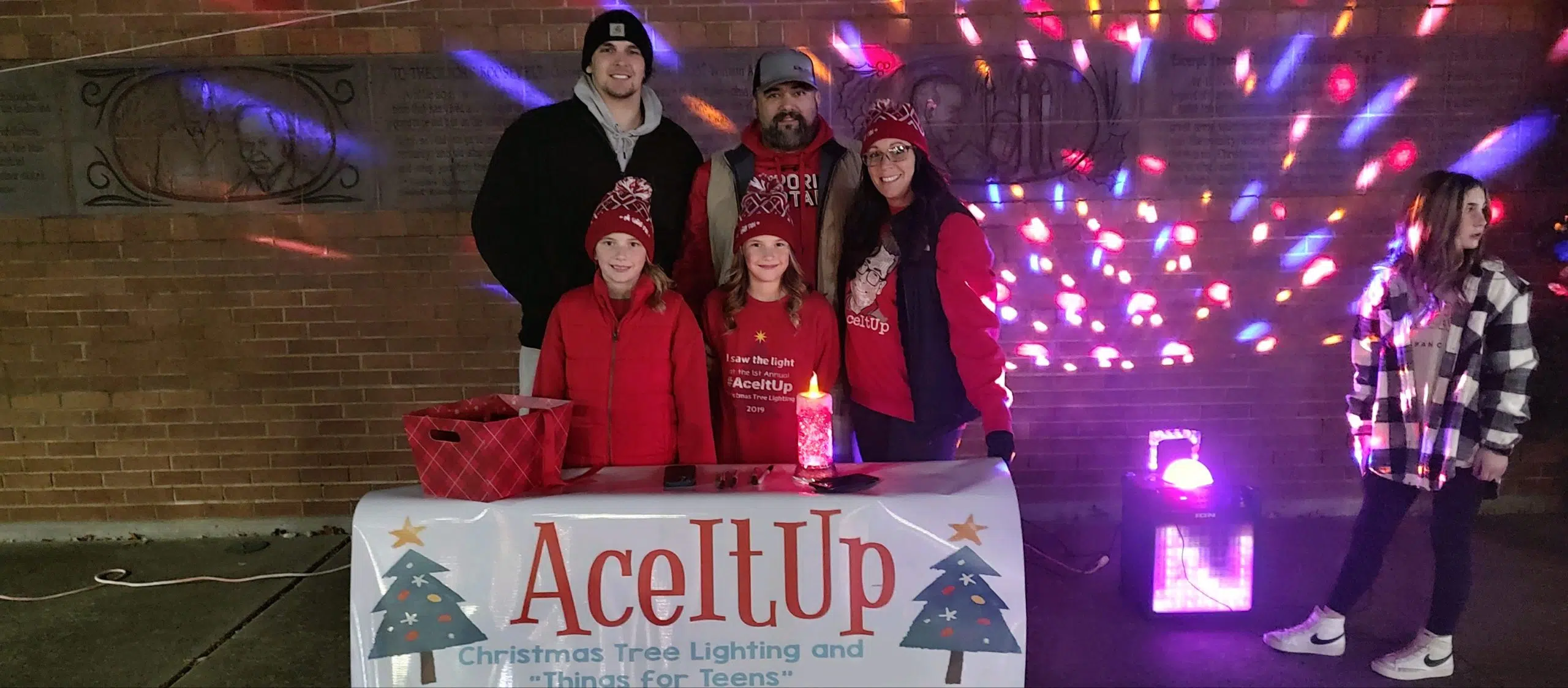 Residents gather for fourth annual Ace It Up Tree Lighting and Toy Drive Sunday night