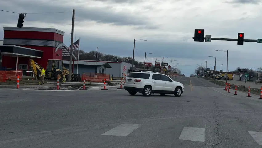 Temporary stoplights being installed at Sixth and Prairie