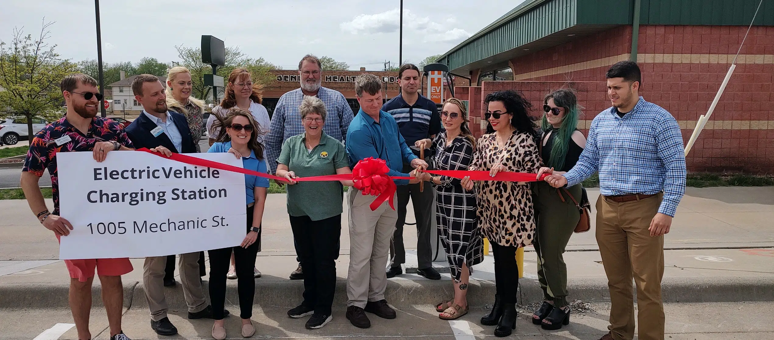 Local leadership cuts ribbon on new electric vehicle charging station Wednesday