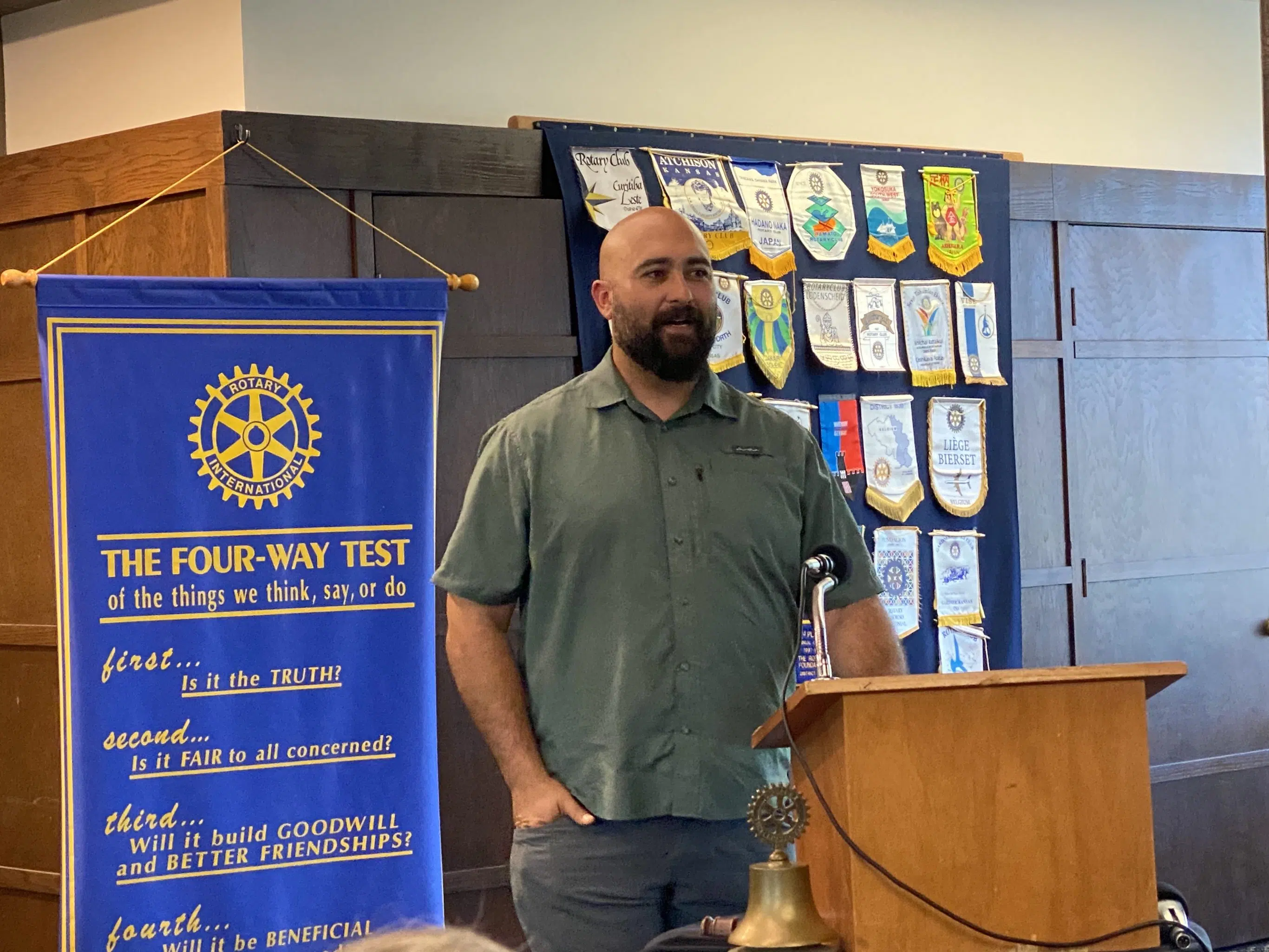 Emporia High football coach Kaden Glinsmann speaks at Rotary Club of Emporia's meeting