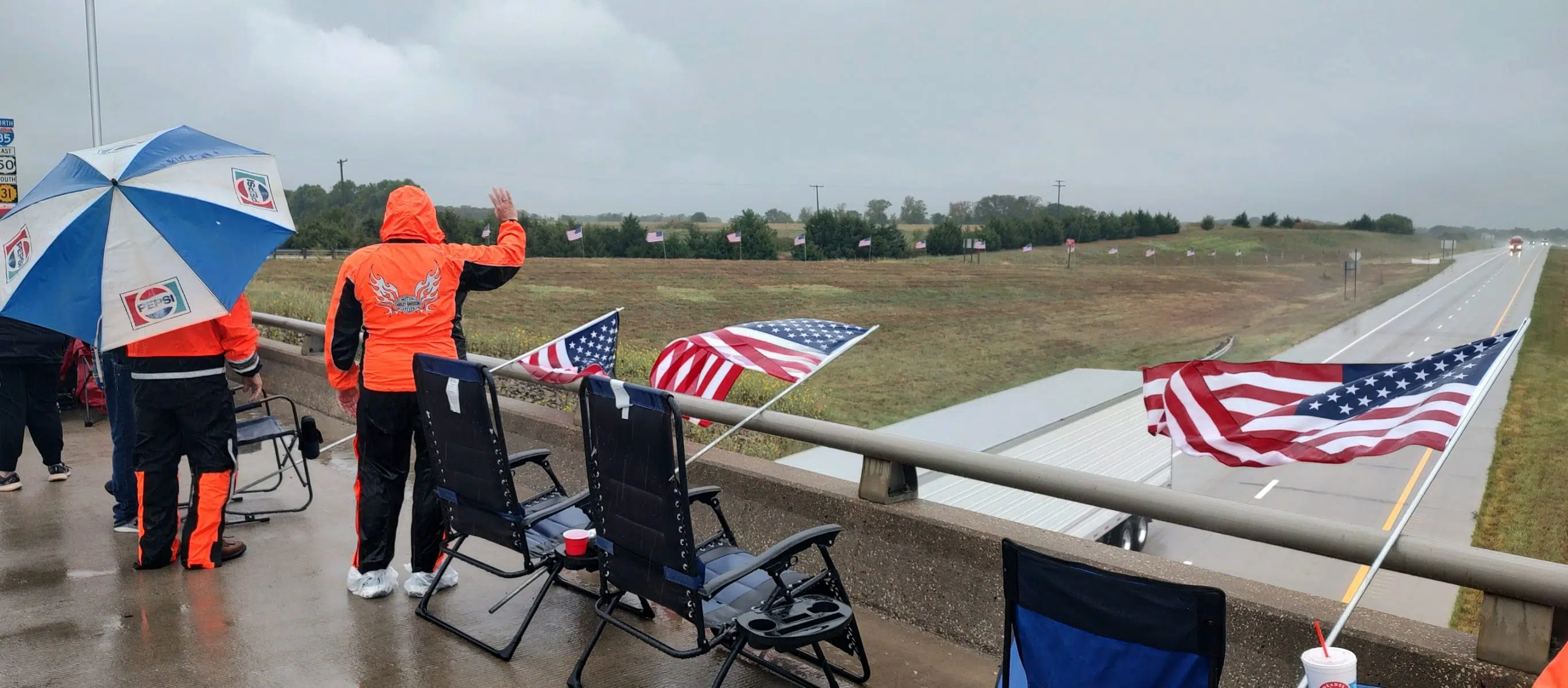 Rainfall does little to dampen sense of patriotism for those taking part in 21st annual Random Acts of Patriotism Monday