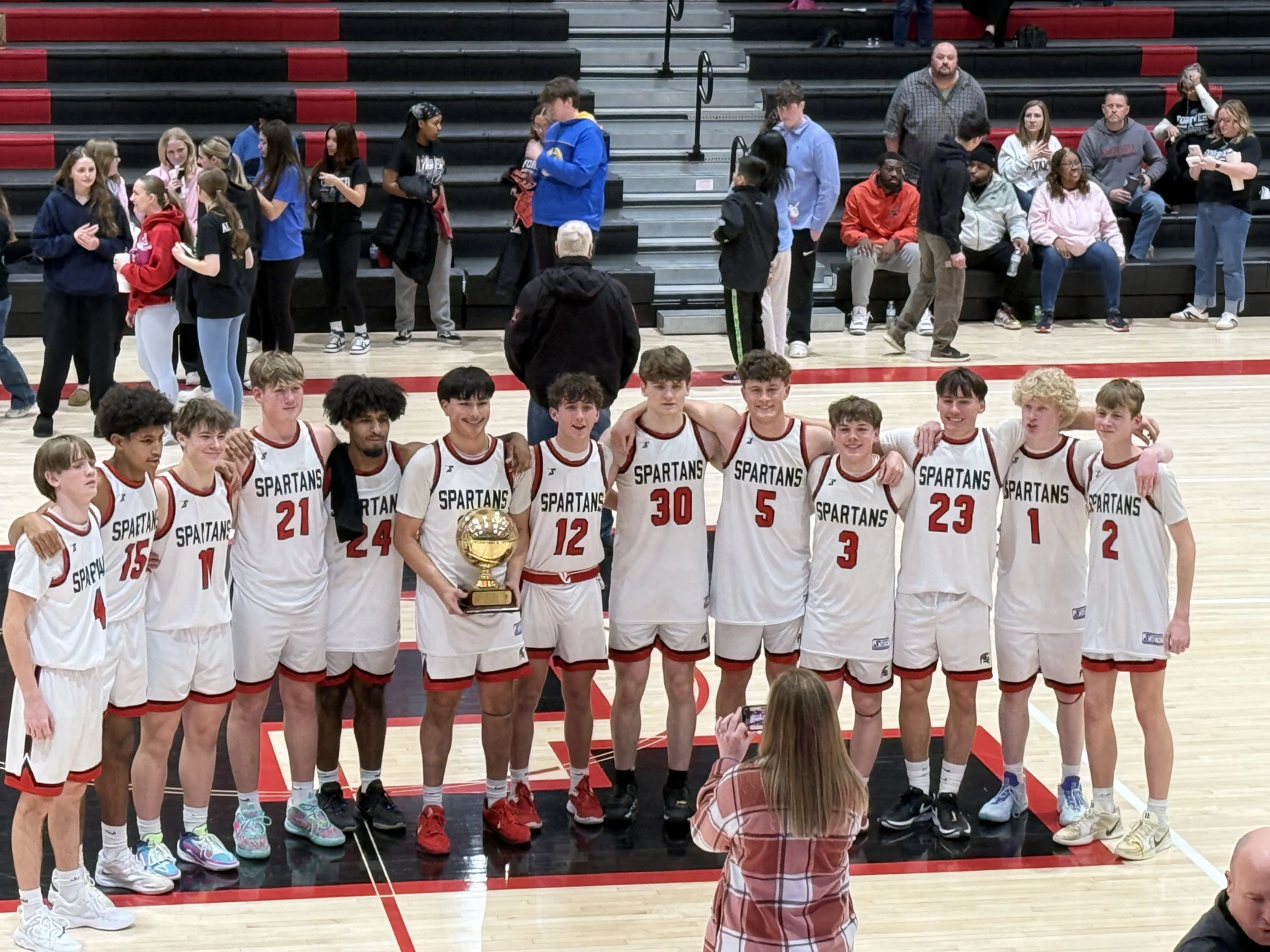 Emporia High boys win Dean Smith Trophy with rout over Topeka High; Lady Spartans fall to Lady Trojans