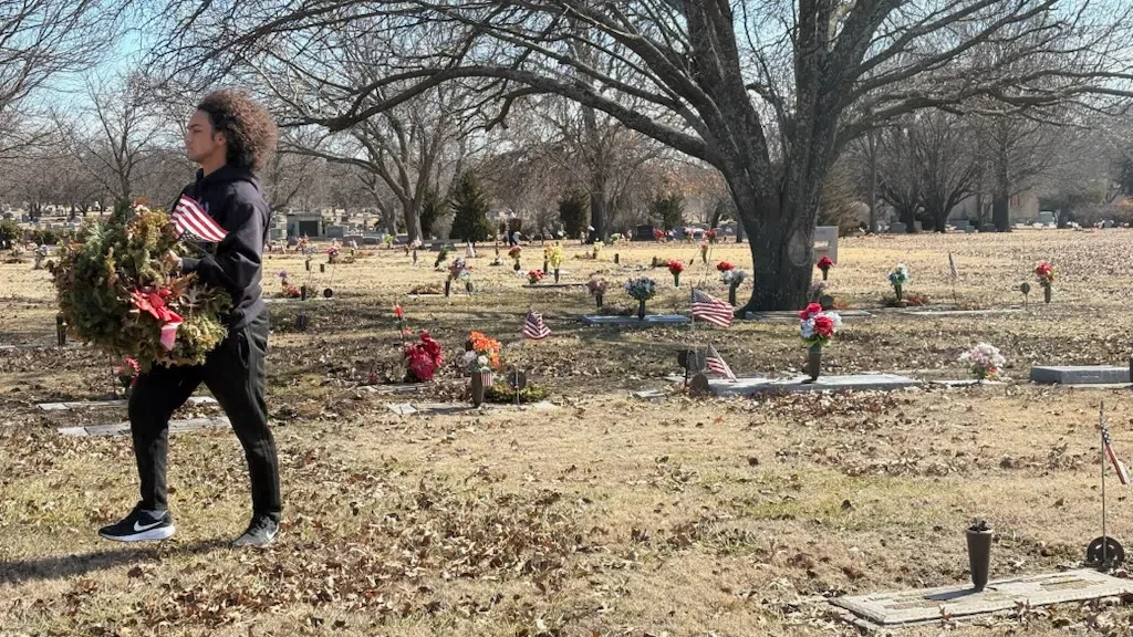 Volunteers pick up over 600 wreaths laid at Maplewood Memorial Lawn Cemetery through Wreaths Across America