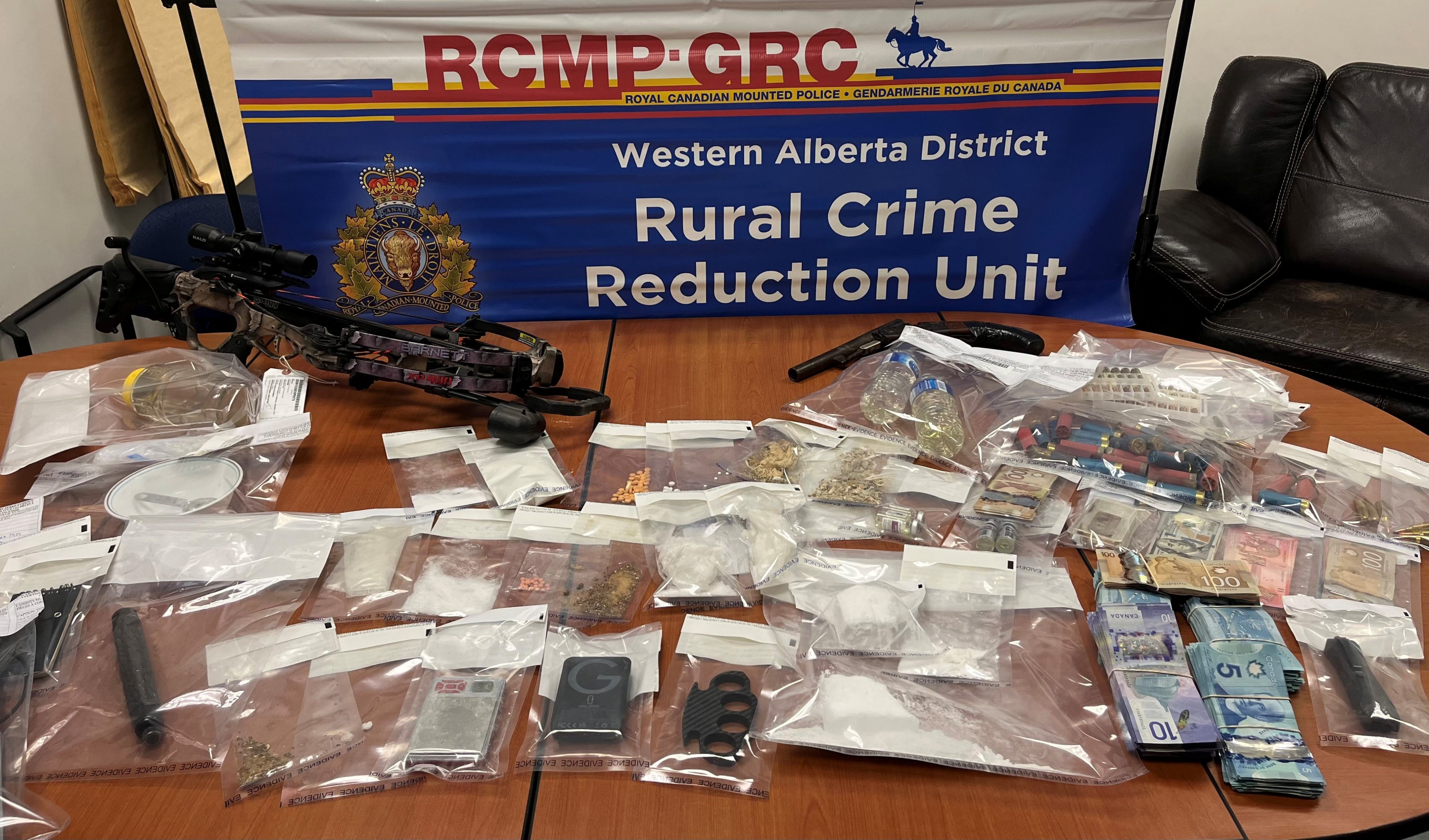 Two Fox Creek residents charged following drugs and weapons seizure