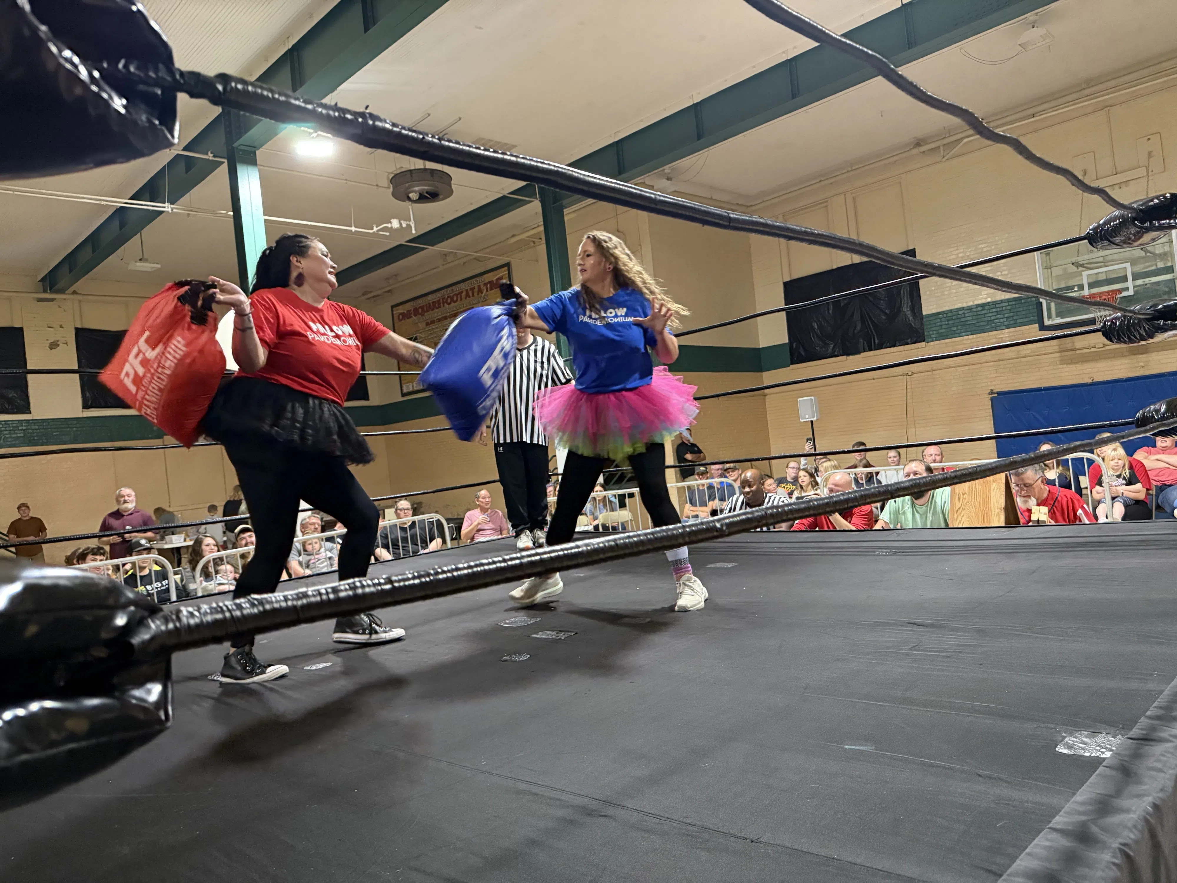 Raccoon teacher Kendra Herman (left) won the Raccoon Rumble bout over Misty Rinehart.