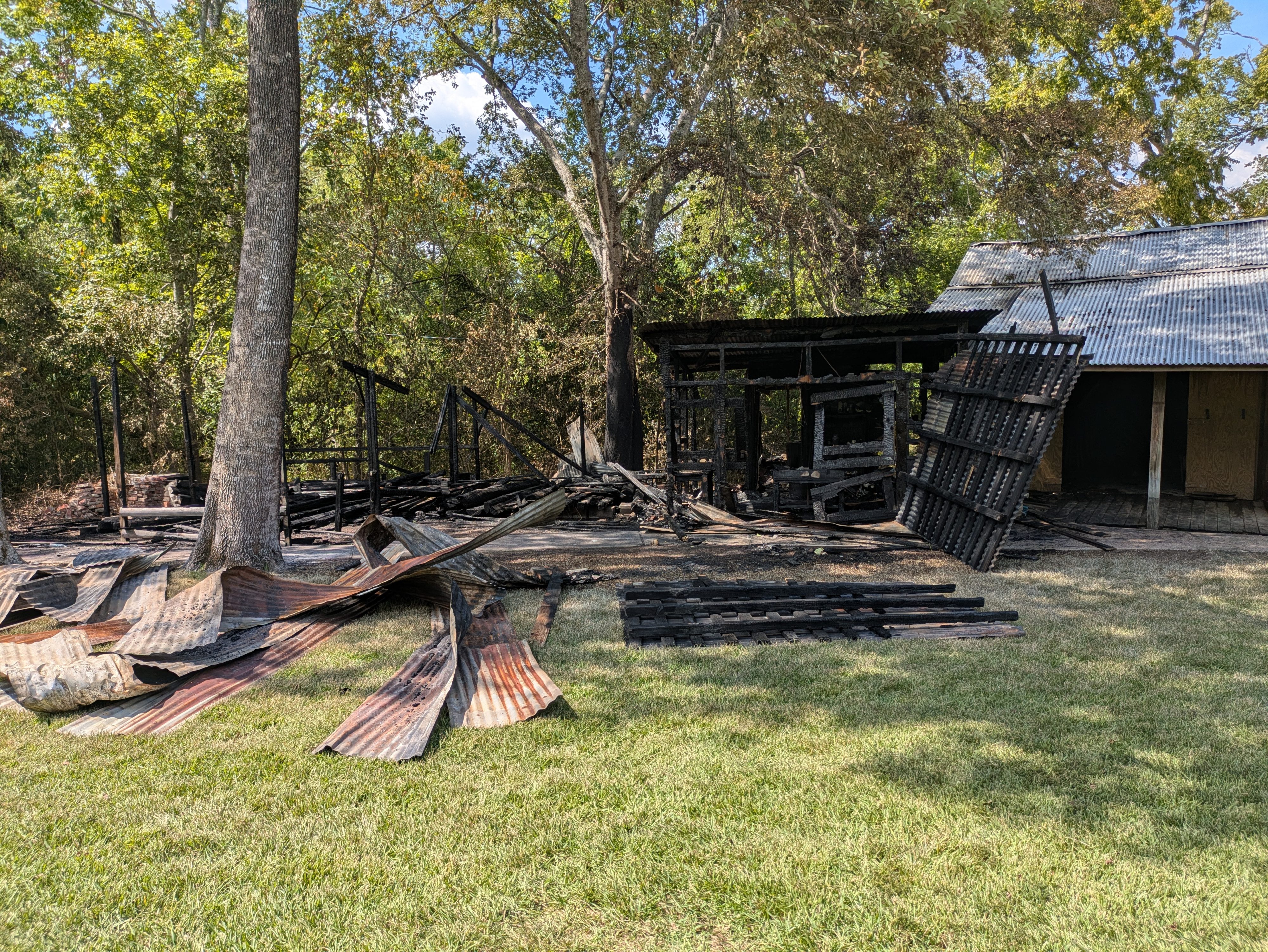 Fire on the grounds of Sam Houston Memorial Museum destroys several small structures.