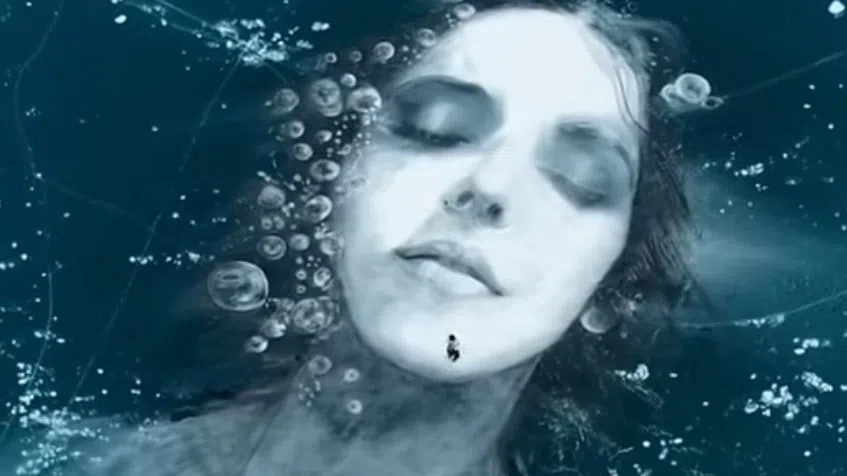 Artist paints massive portrait on Abraham Lake ice