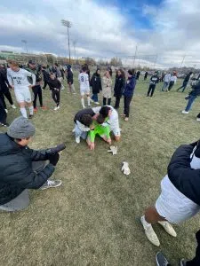 MRU Cougars men’s soccer players celebrate on the field after winning a ten-round shootout against the University of Calgary Dinos at Stadium Field.
