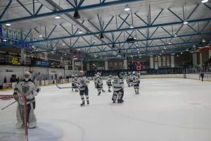 The Cougars salute the crowd after their 6-4 victory against the Huskies.