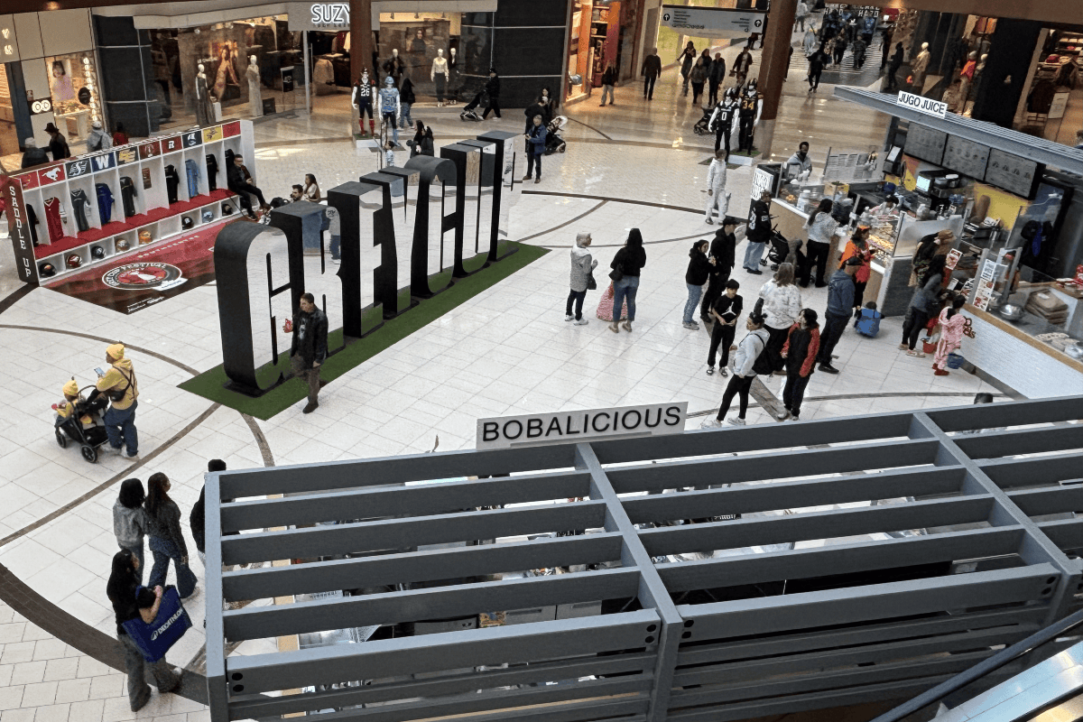An open space in Southcentre Mall where trick-or-treaters in costume are gathering,