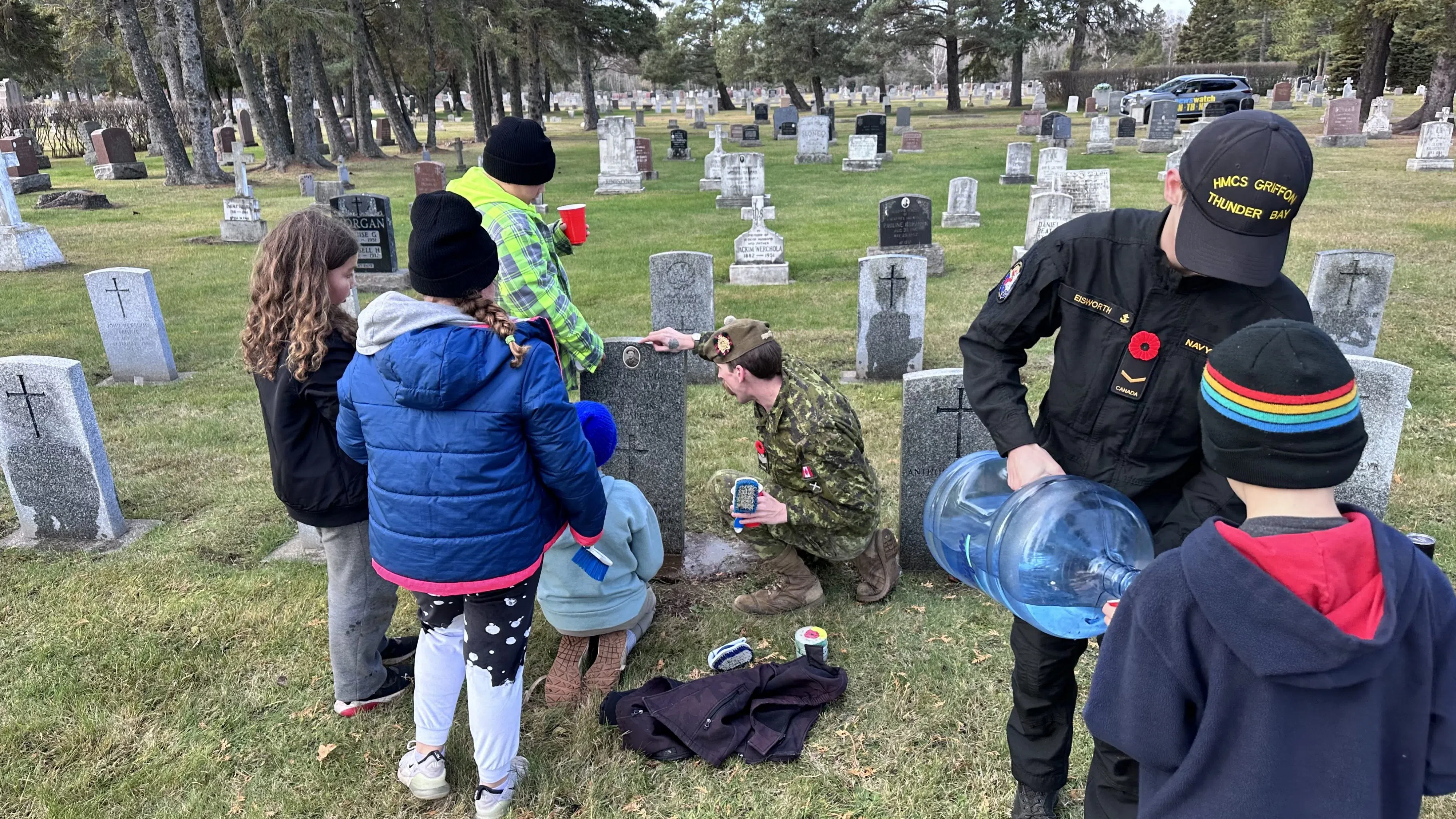 Students helping clean veteran headstones ahead of Remembrance Day