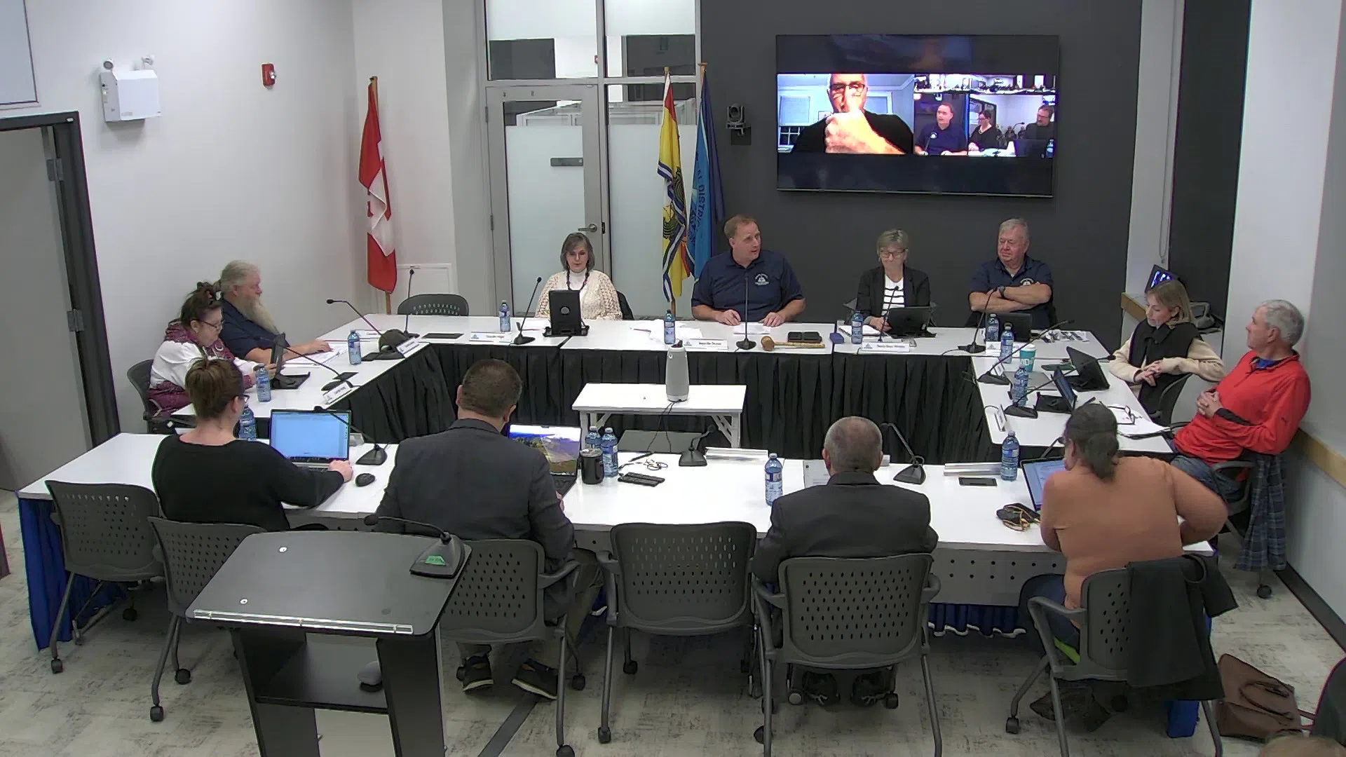 Several St. Stephen councillors sit around a table.