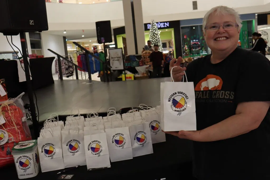 Stacy Beckett, sales associate from Western Varieties all smiles at the Holiday Market in West Edmonton Mall 