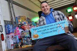 Can Man Dan sitting at the box truck for the Toy and Food Drive at Toys R Us (Photo Credits – Daniel Barker-Tremblay)