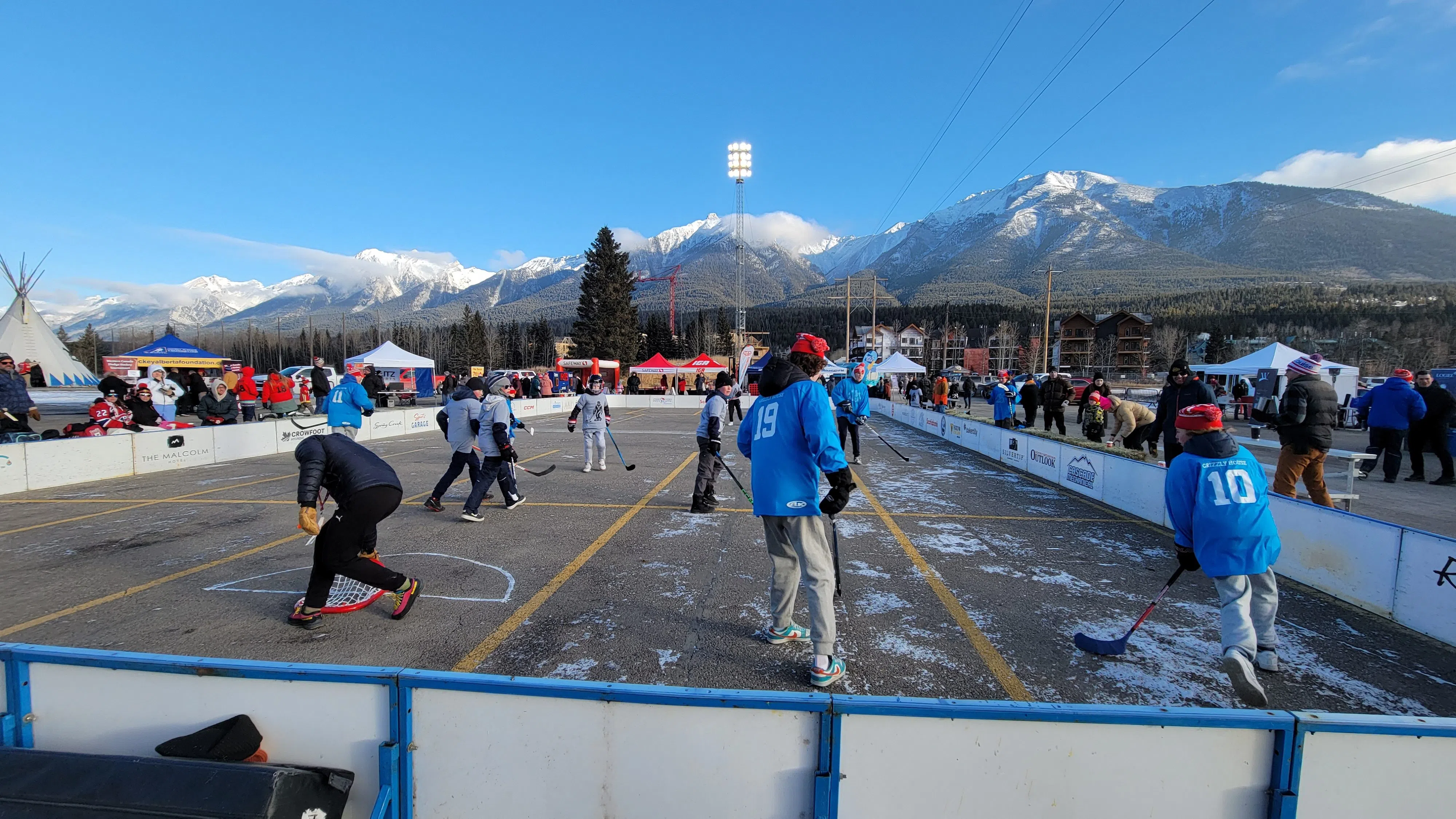 Hockey Day in Canada in Canmore, two teams of mixed kids playing street hockey, photo credit Keith Driver