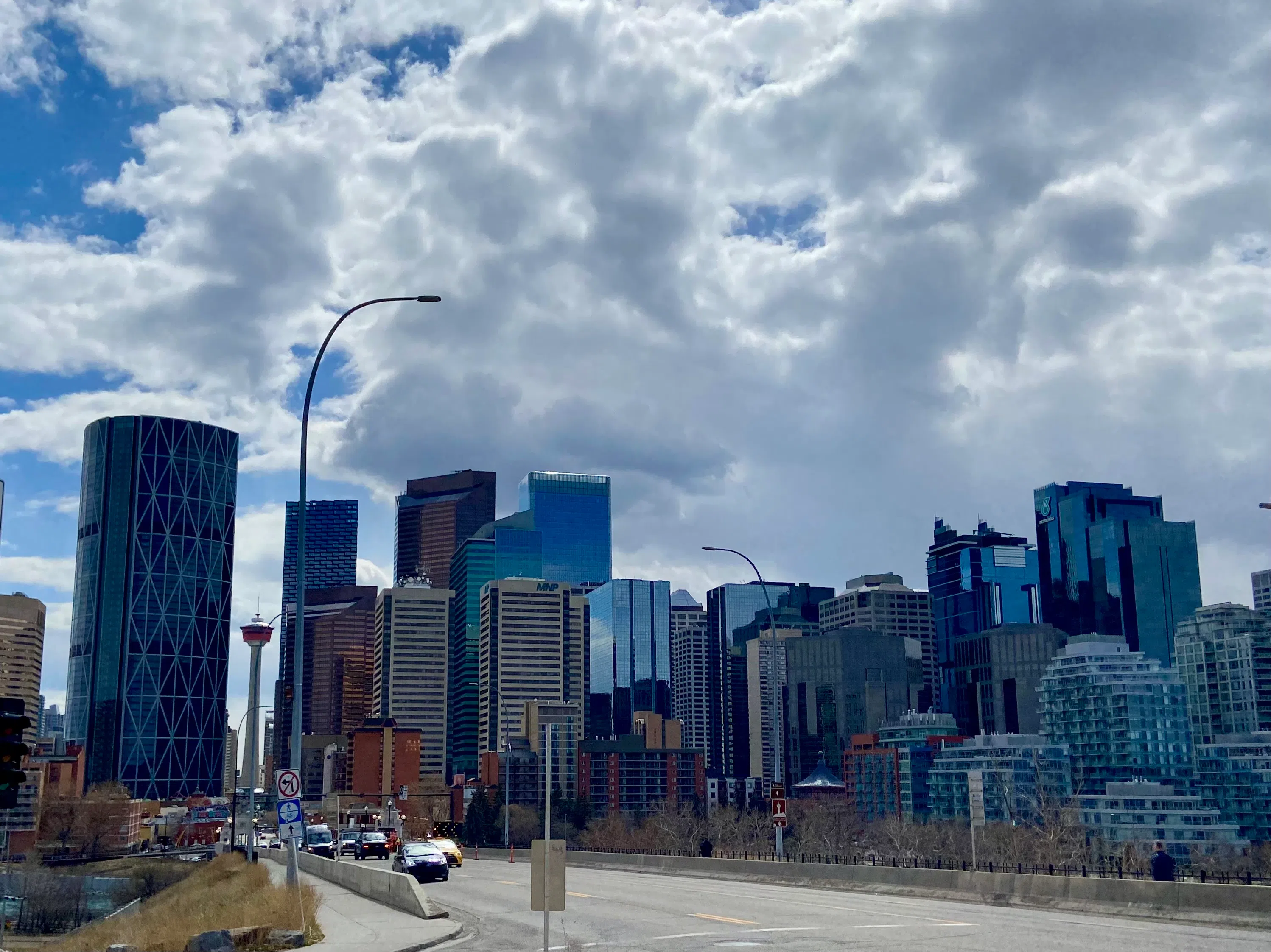 Downtown Calgary under a vibrant sun and cloud sky, Spring 2025, Photo by William L. Baliko