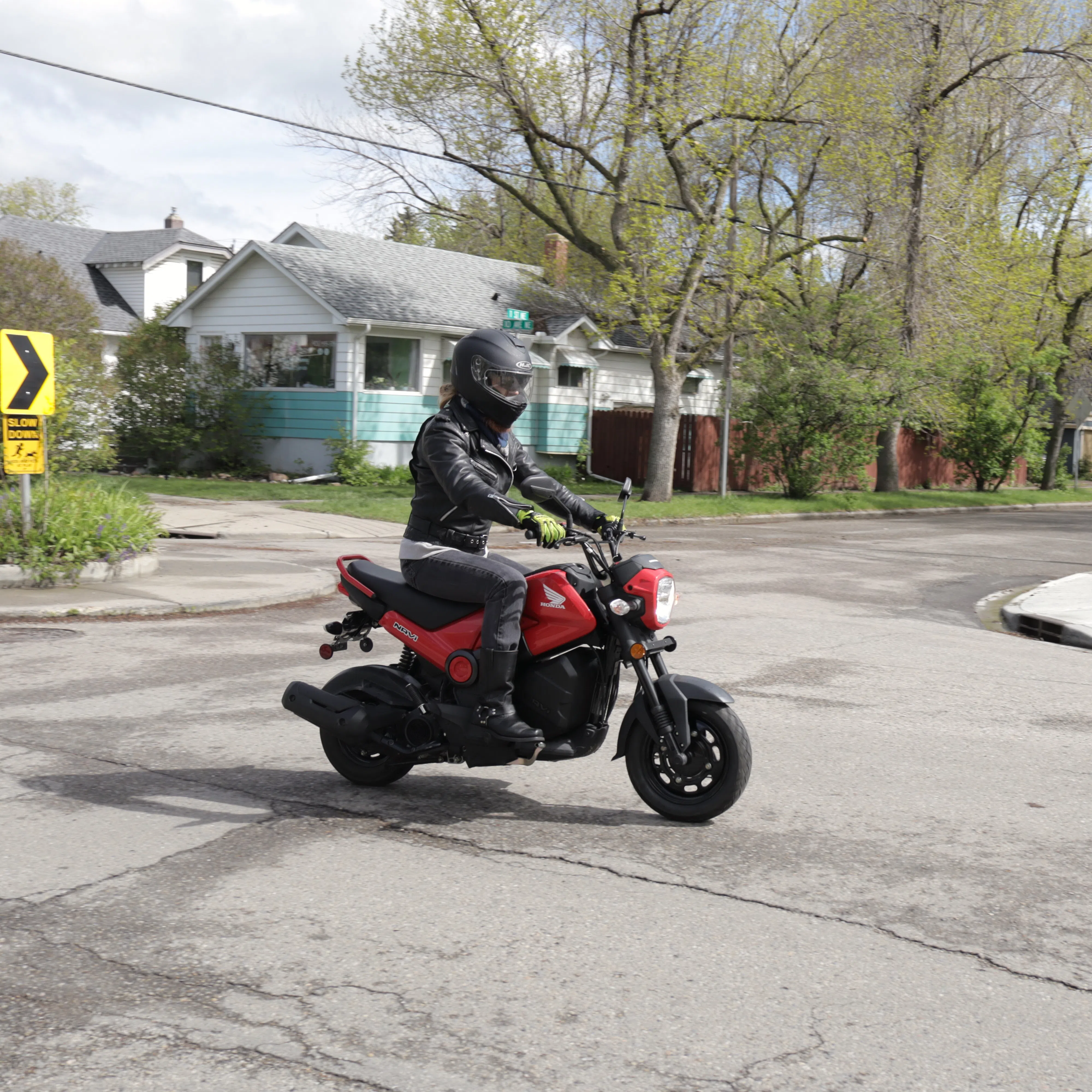 A motorcyclist commuting on their bike in May 2025. Photo of the biker by Cassidy Waterchief-Calf.