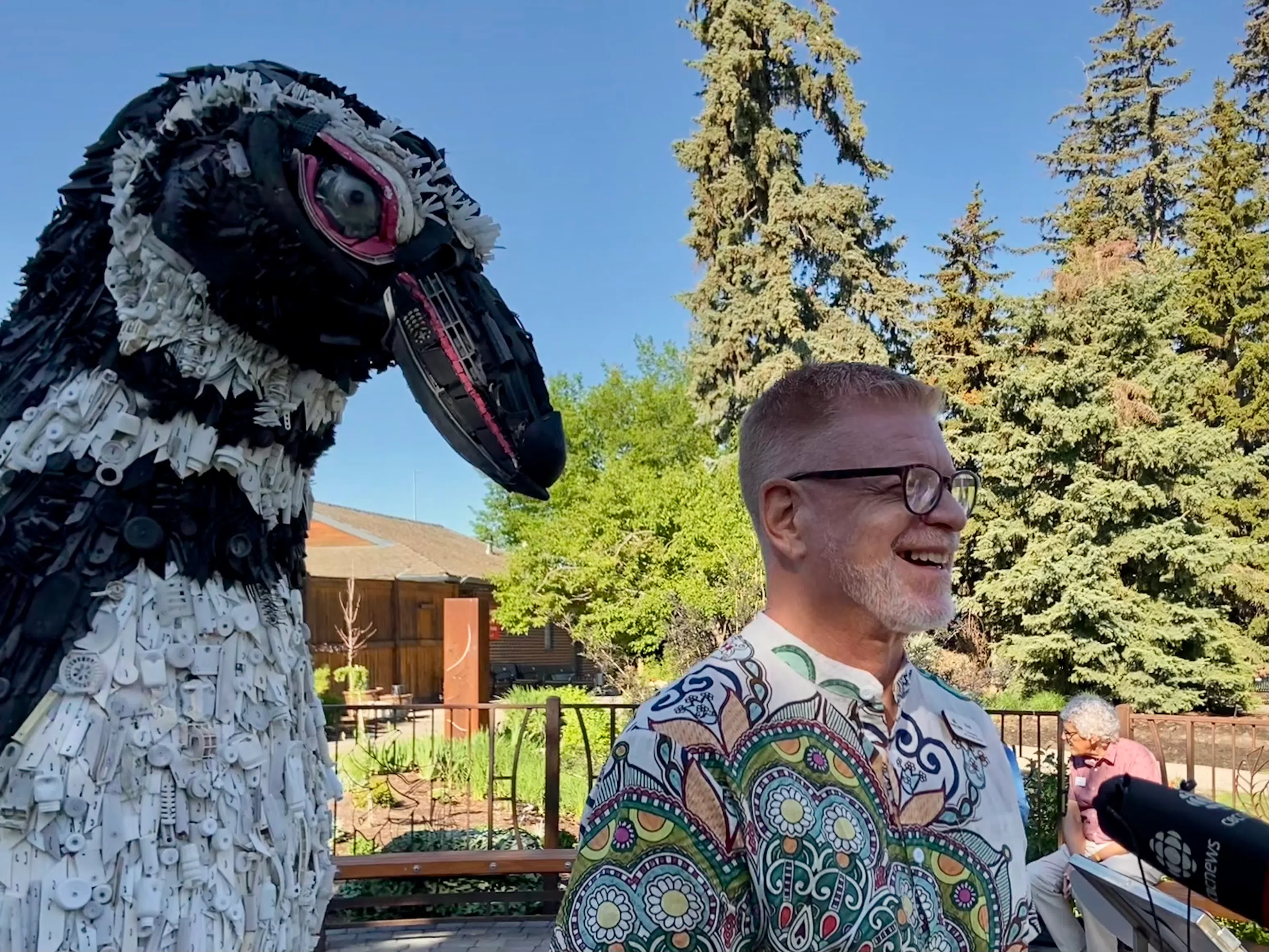 Brady Parks in front of one of the new made-from-washed-ashore-trash artworks at the Wilder Institute and the Calgary Zoo at the grand unveiling. Photo by William L Baliko