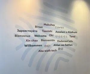 Oki and welcome sign at the Confluence. Photo by William L. Baliko