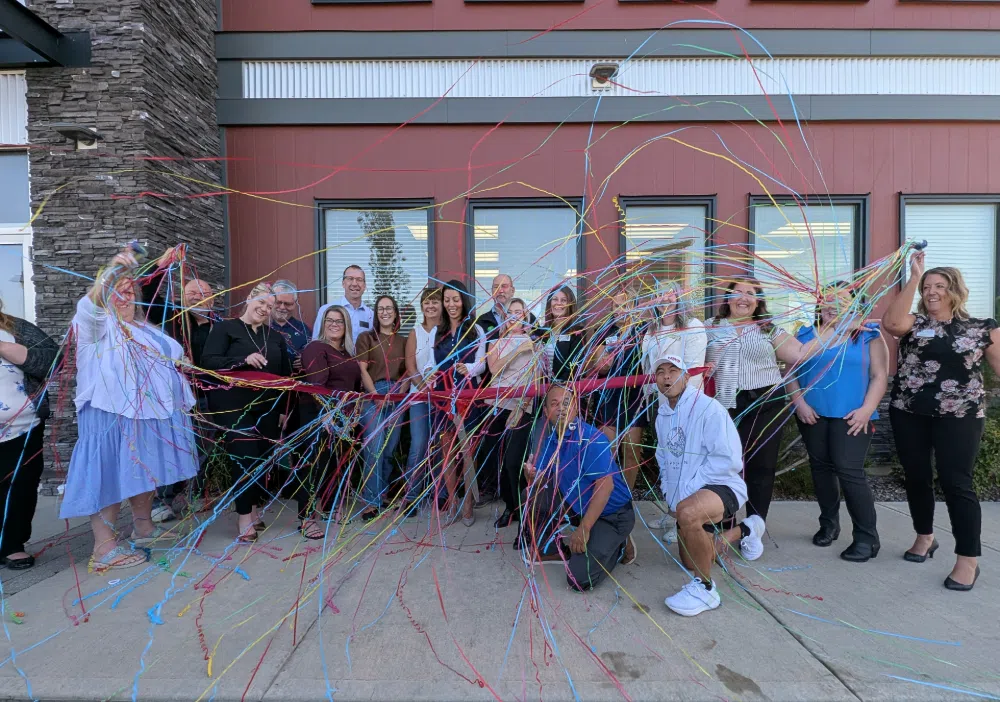 People celebrating a ribbon cutting