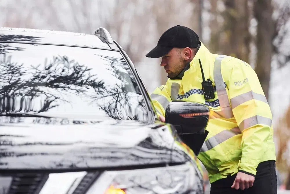 Cop at a car window