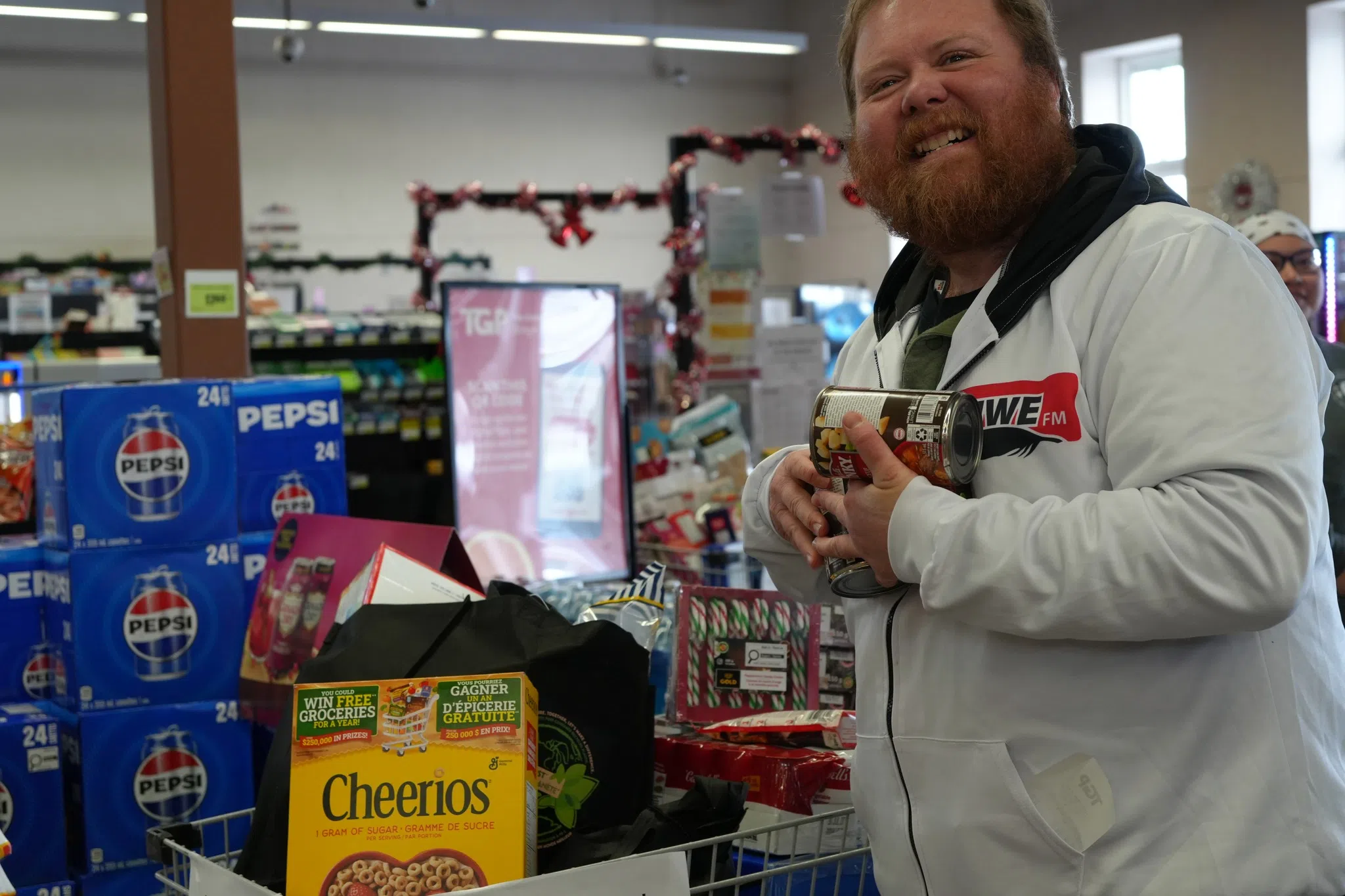 Person donating money to food drive