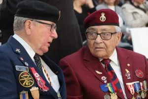 Indigenous Veterans speaking with one another at the Indigenous Veterans Day Ceremony inside City Hall (Photo Credits - Daniel Barker-Tremblay)