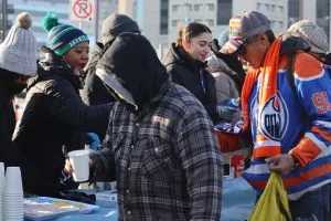 Community members grabbing coffee at the Winter Carnival (Photo Credits - Daniel Barker-Tremblay)