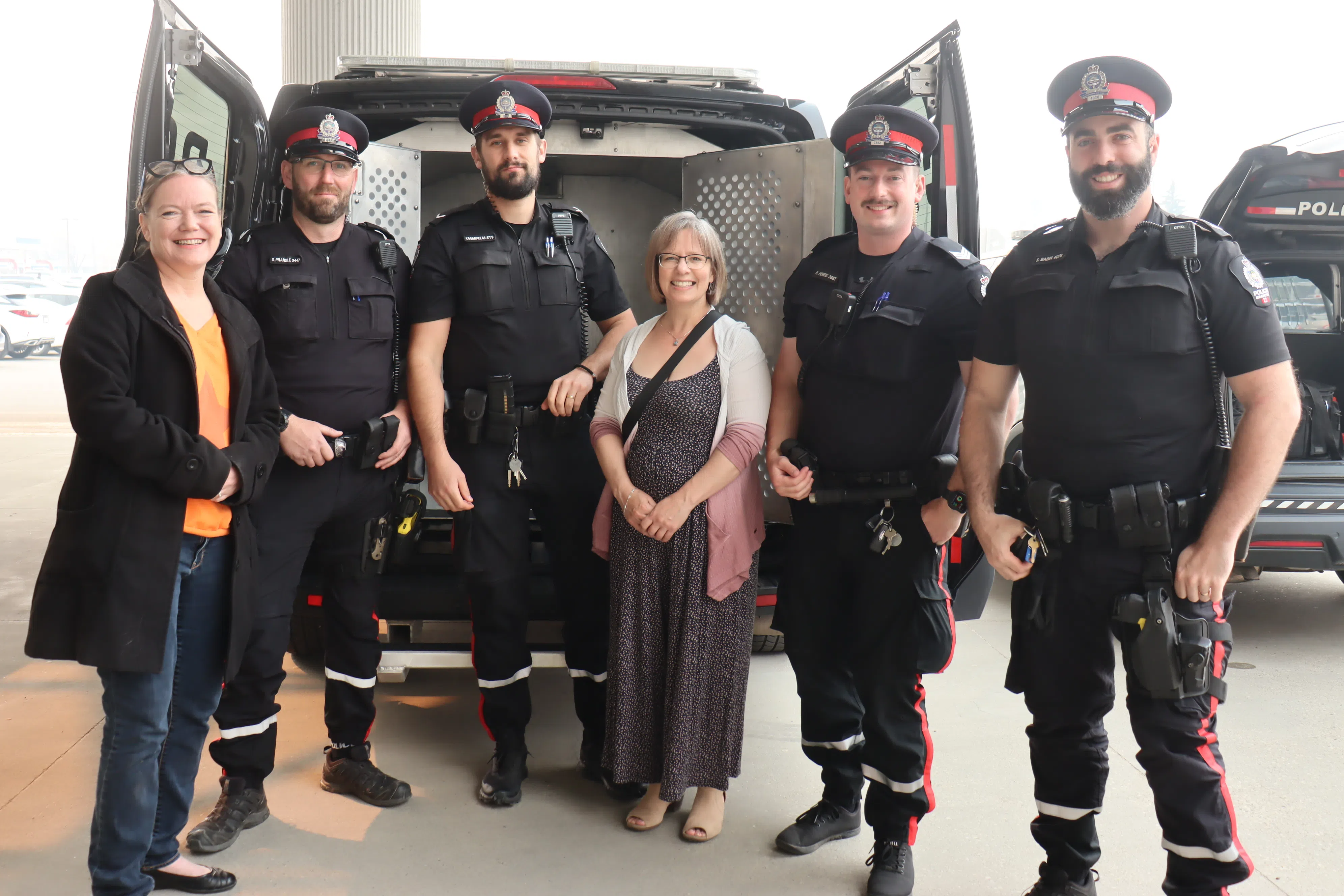 Edmonton Police Officers with Radius Health Pregnancy Pathway Members at Cram A Cruiser (Photo Credits - Daniel Barker-Tremblay)