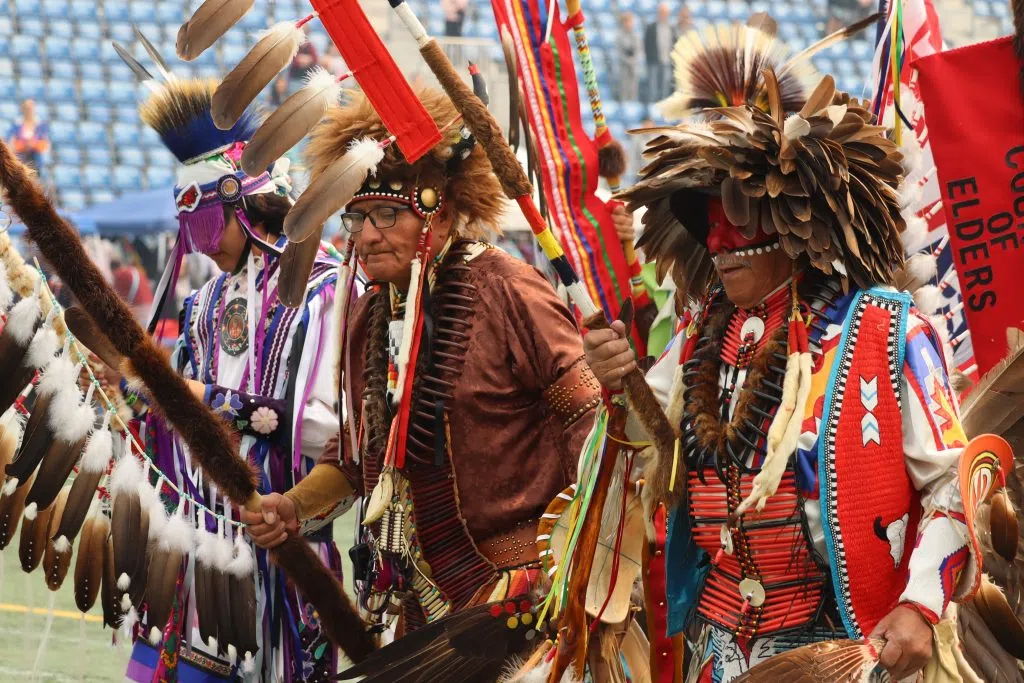 Traditional Dancers holding the Grand Staff during the Grand Entry at the 40th Annual Ben Calf Traditional Pow Wow (Photo Credits - Daniel Barker-Tremblay)