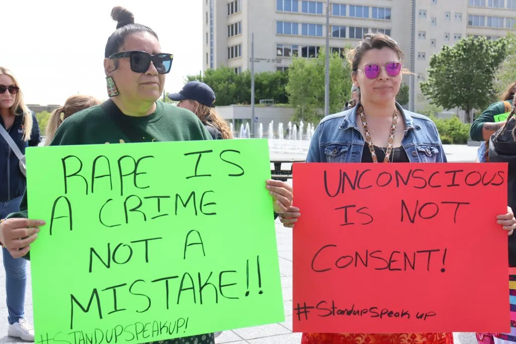 Women holding up signs at the Stand Up Walk to End Sexual Violence (Photo Credits - Daniel Barker-Tremblay)