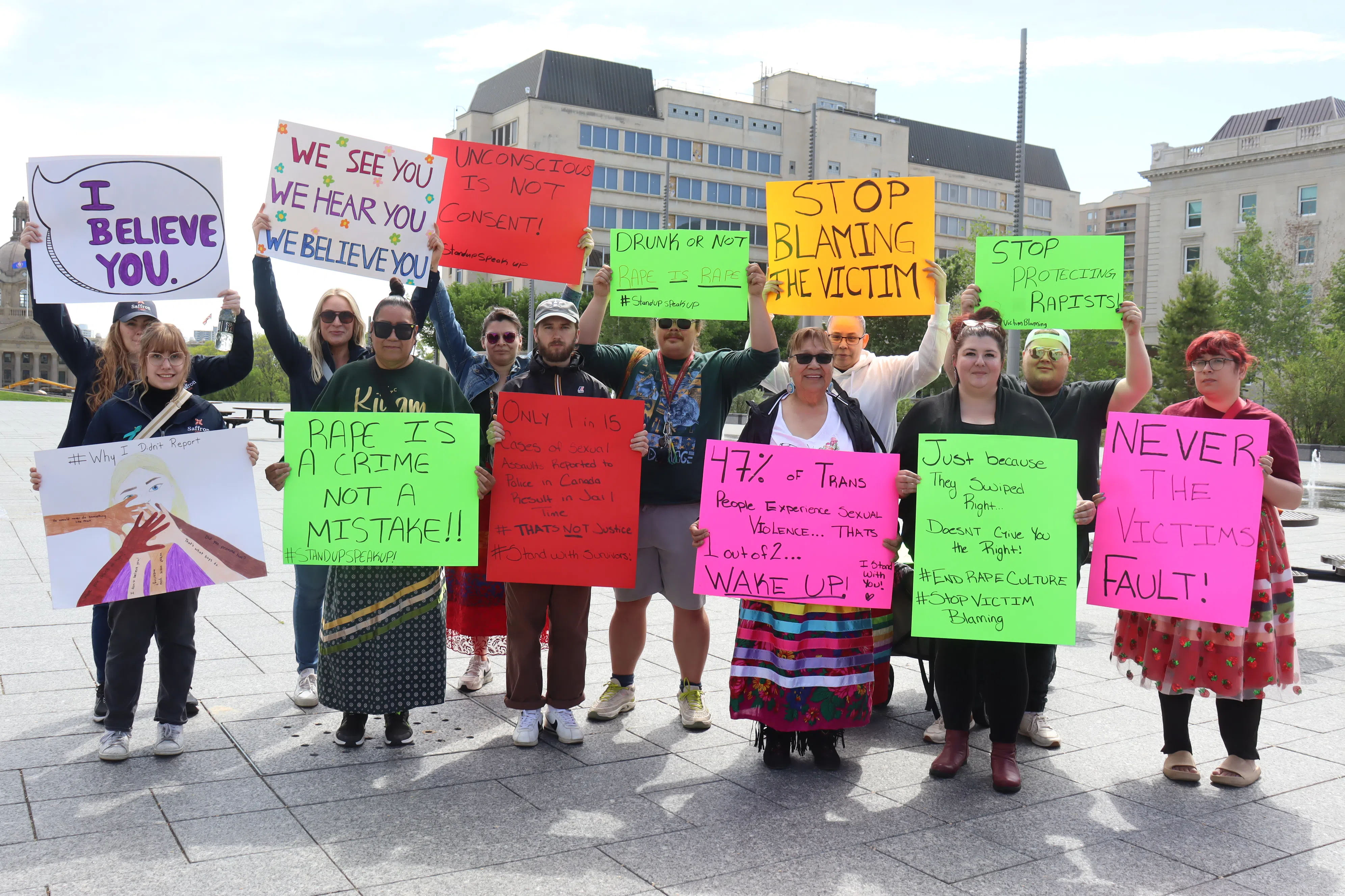 Creating Hope Society and community members holding up signs at the Stand Up Walk to End Sexual Violence (Photo Credits - Daniel Barker-Tremblay)