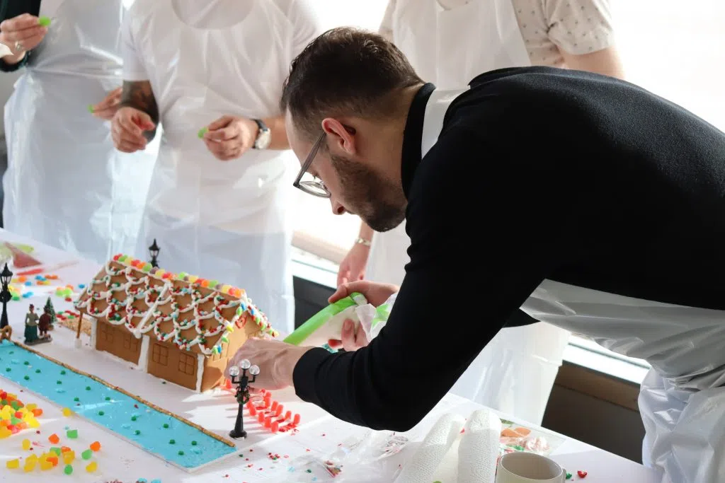 A competitor focused on his creation at the 2024 Christmas Bureau Gingerbread Competition (Photo Credits - Daniel Barker-Tremblay)