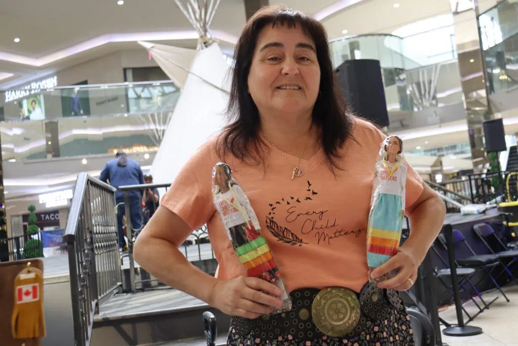 Tracy Boucher of TB Crafting holding designed dolls at the National Day for Truth and Reconciliation event at WEM (Photo Credits - Daniel Barker=Tremblay)