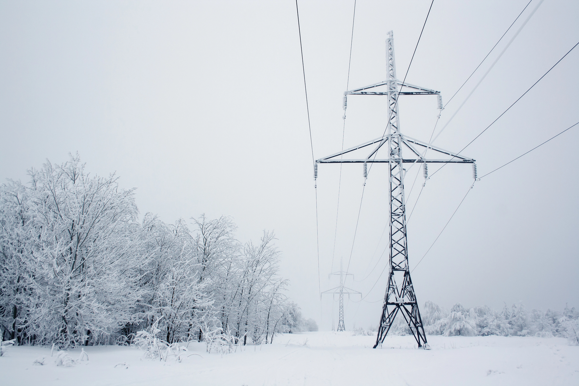 Power lines in winter. Stock photo; not taken in Yukon.