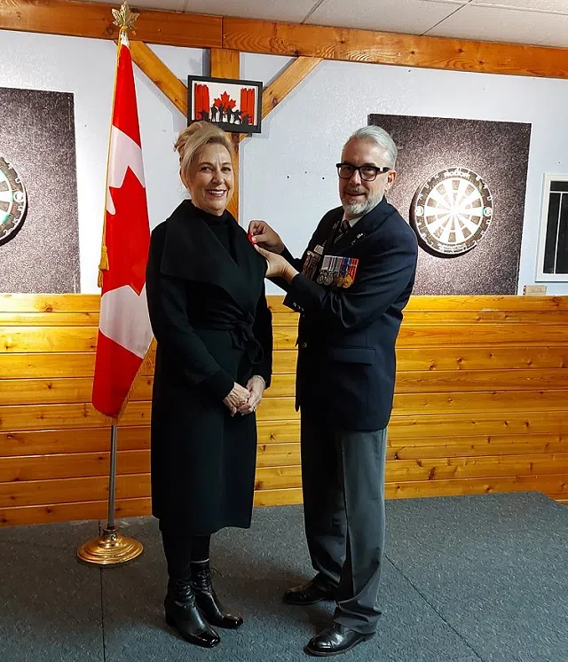 First Poppy Given To Mayor Colberg