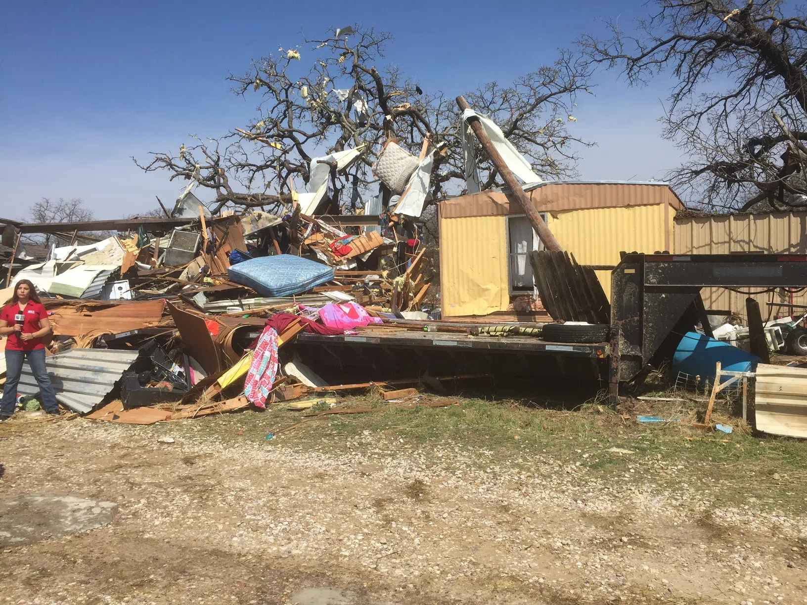 High winds from the Tolar storm blew one mobile home on top of the other.