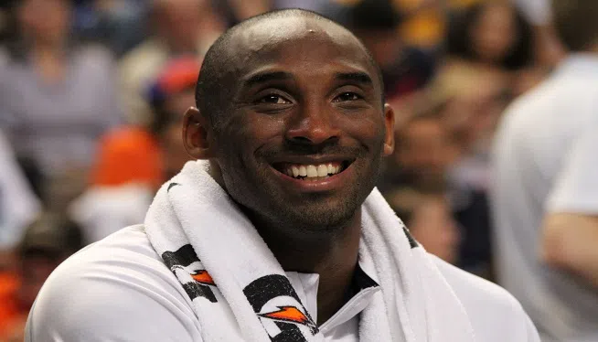 Kobe_Bryant_smiling_on_the_bench_USA_vs_GBR_2012